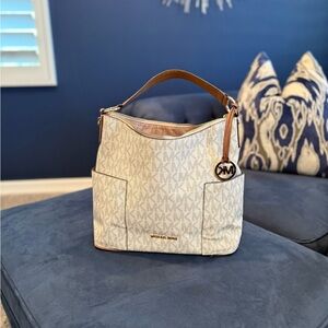 Michael Kors Tan and Brown Hobo Bag. like new used twice. Clean on the inside.